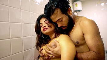 A young woman undresses and experiences intense intercourse in a bathroom