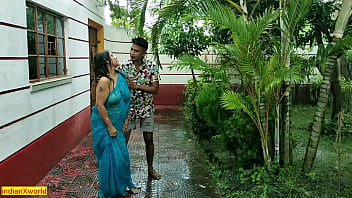 Indian mature woman engages in outdoor sex during rainy weather