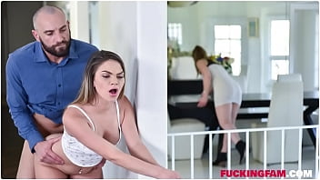 Athena Faris performs footjob on stepdad while hiding under the table