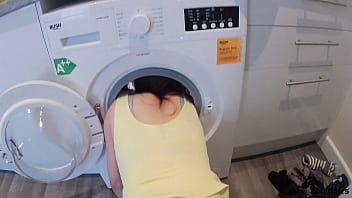 A European student seeks help from her stepbrother during a stuck washing machine incident